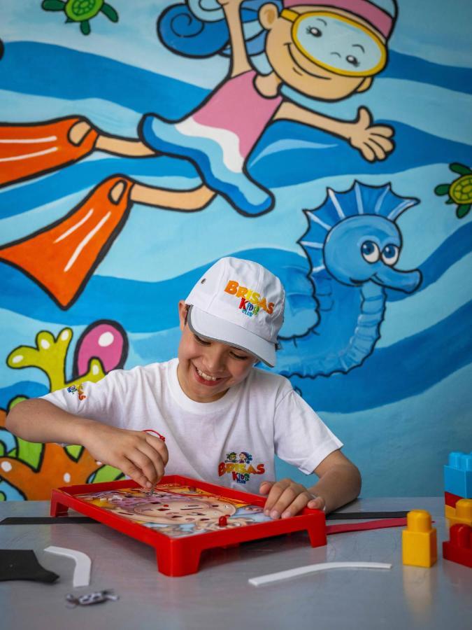 Las Hadas By Brisas Manzanillo Extérieur photo Child at the DREAMS Center